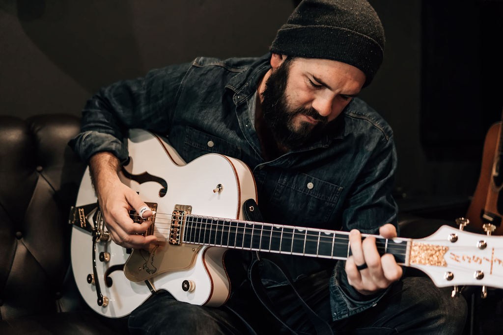 Jon Jimmerson playing an electric guitar